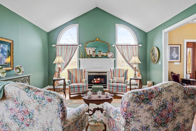 living room with vaulted ceiling and hardwood / wood-style floors