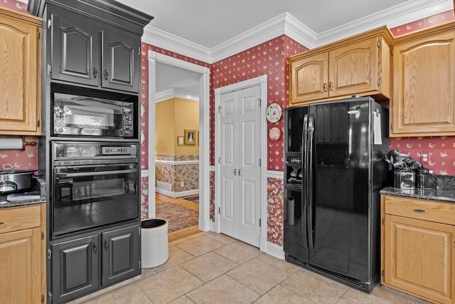 kitchen featuring light tile patterned flooring, ornamental molding, dark stone counters, and black appliances