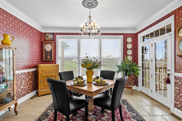 dining room with crown molding and a chandelier