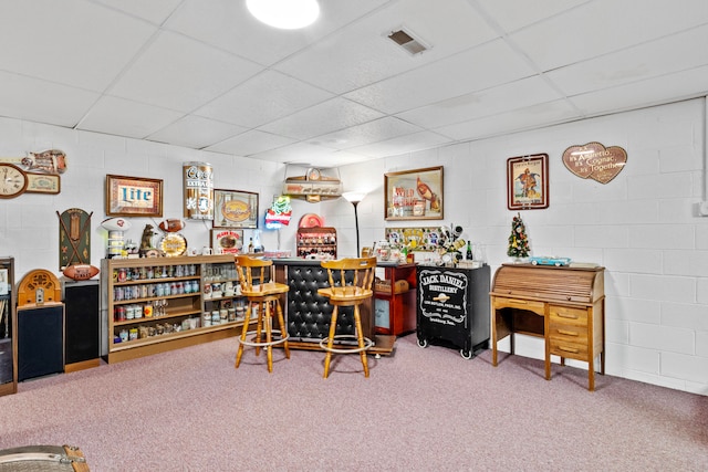 office featuring bar, carpet floors, and a drop ceiling