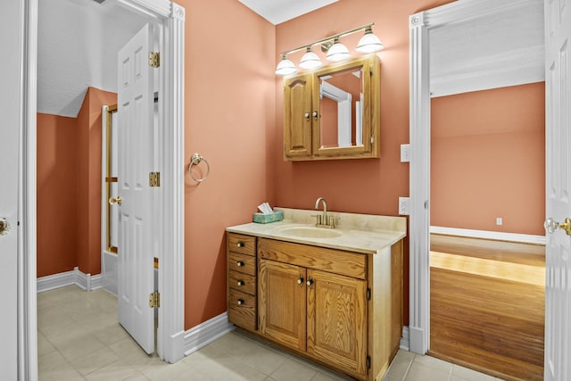 bathroom with tile patterned flooring and vanity