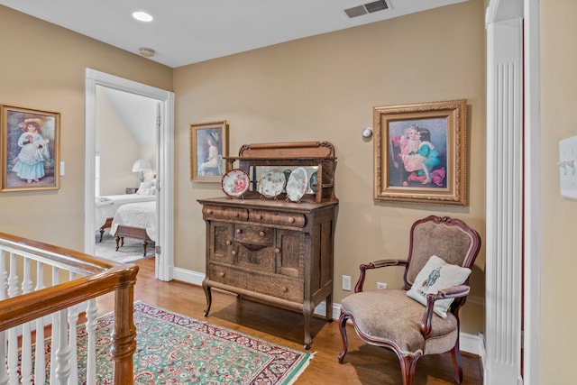 living area with light hardwood / wood-style flooring