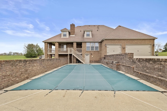 view of pool featuring stairway, fence, and a fenced in pool