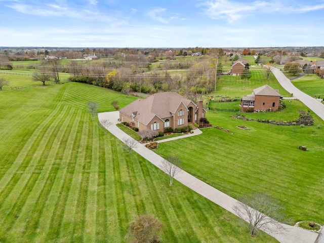 birds eye view of property with a rural view