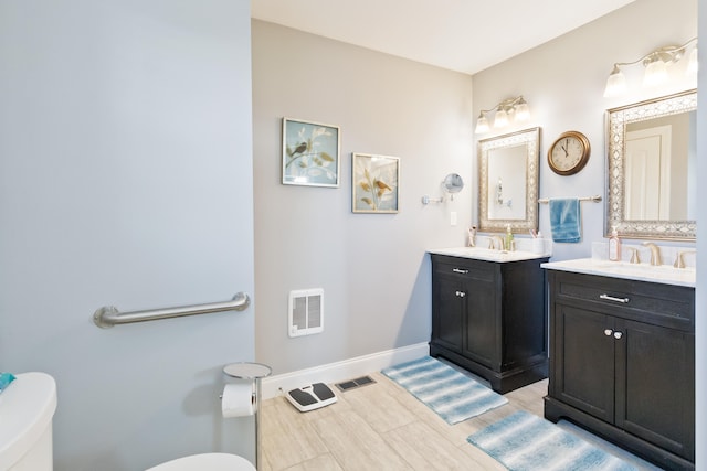 bathroom featuring vanity and wood-type flooring