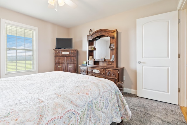 carpeted bedroom featuring ceiling fan