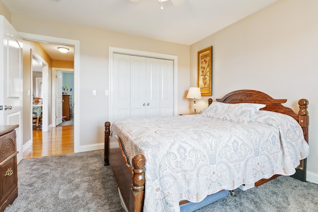 carpeted bedroom featuring a closet and ceiling fan