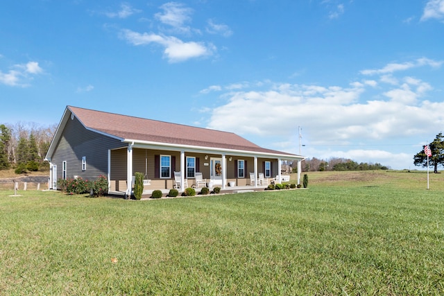 view of front of home featuring a front lawn and covered porch