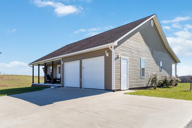 view of property exterior featuring a garage, a porch, and a yard