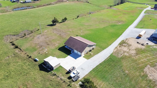 birds eye view of property featuring a rural view