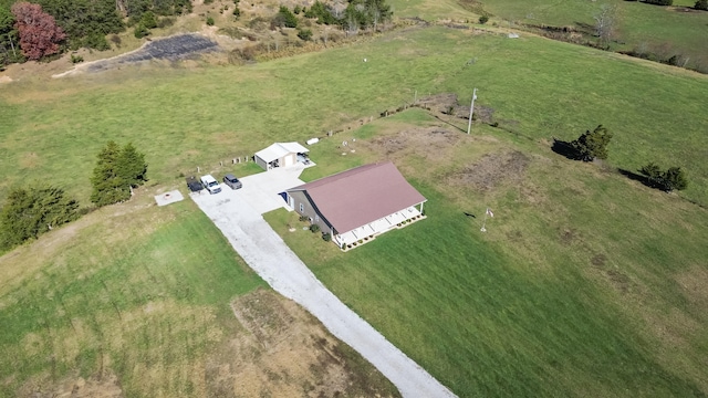 birds eye view of property with a rural view