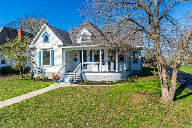 view of front of house with a porch and a front lawn