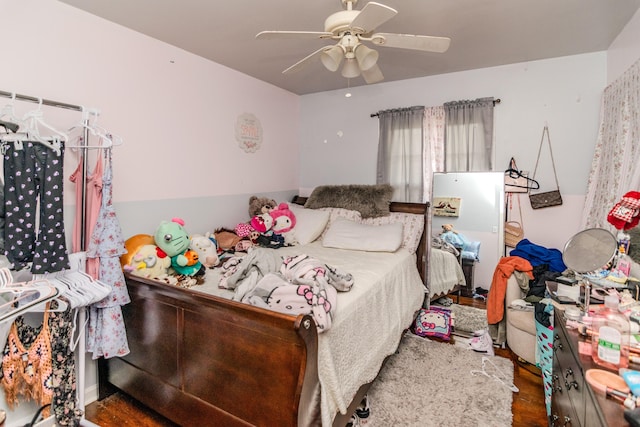 bedroom featuring ceiling fan and dark hardwood / wood-style flooring