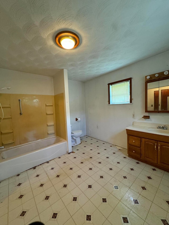 full bathroom with toilet, tub / shower combination, vanity, and a textured ceiling