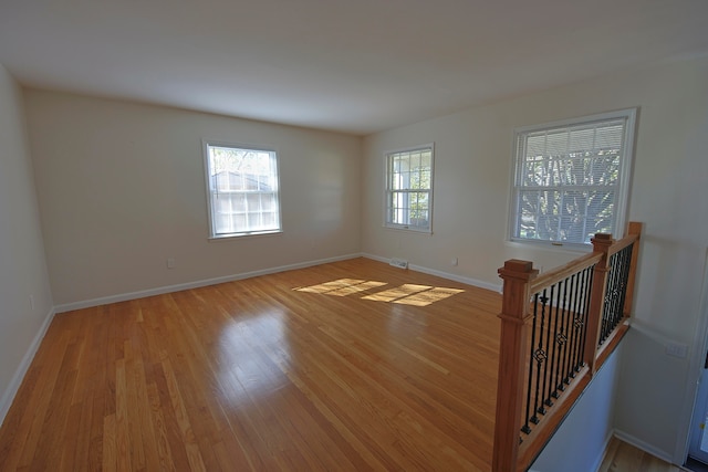 unfurnished room featuring light wood-type flooring