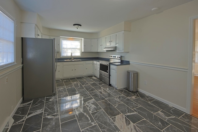 kitchen featuring white cabinetry, stainless steel appliances, and sink