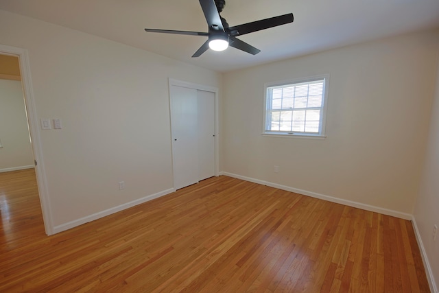 spare room with ceiling fan and light hardwood / wood-style floors