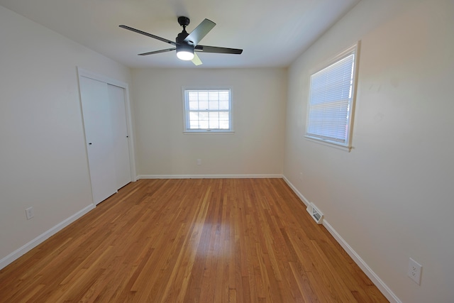 unfurnished room featuring light hardwood / wood-style flooring and ceiling fan