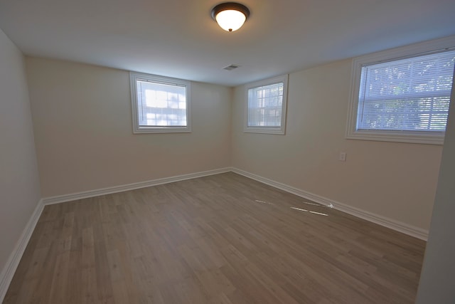 empty room featuring wood-type flooring