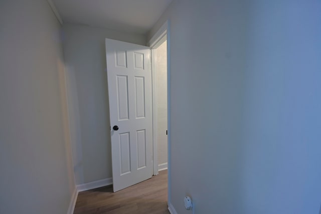 hallway with light hardwood / wood-style floors