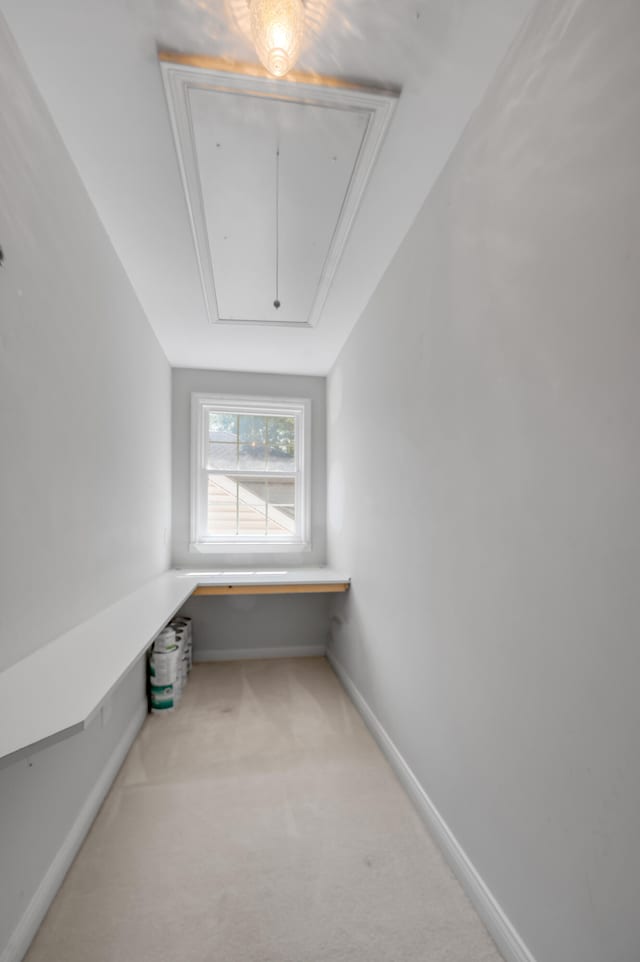 hallway with light colored carpet