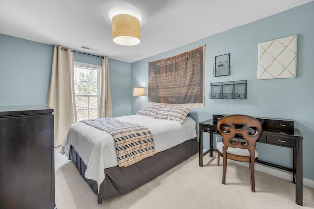 bedroom featuring light colored carpet