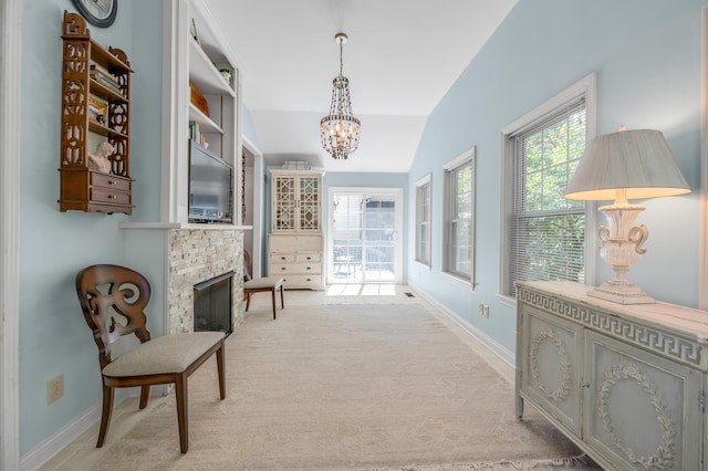 hallway with light carpet, vaulted ceiling, and an inviting chandelier