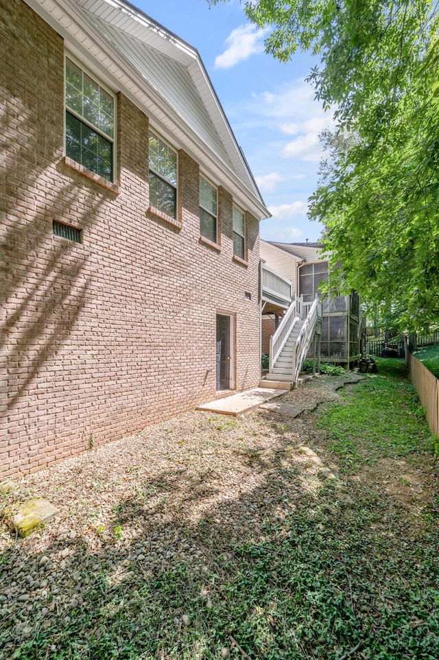 back of property featuring a sunroom