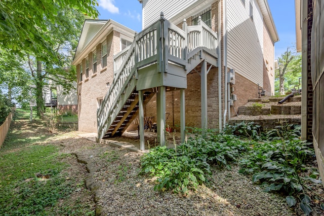 rear view of property with a wooden deck