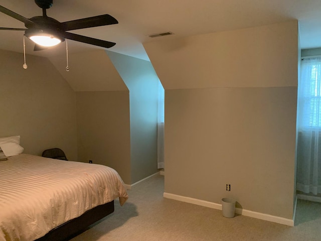 bedroom featuring ceiling fan, light carpet, and lofted ceiling