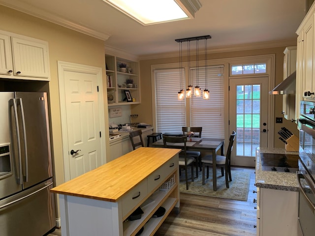 kitchen featuring wooden counters, stainless steel refrigerator with ice dispenser, dark wood-type flooring, white cabinets, and a kitchen island