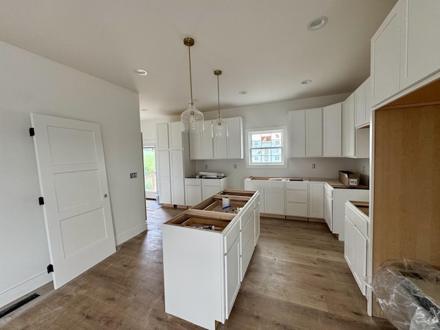 6033 Arbor Woods Way, Richmond, KY 40475 - kitchen featuring a kitchen island, wood finished floors, recessed lighting, white cabinetry, and hanging light fixtures