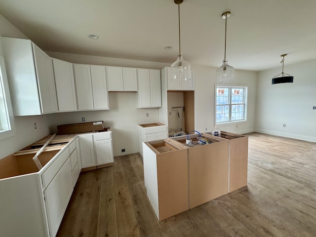 6033 Arbor Woods Way, Richmond, KY 40475 - kitchen with light wood-style floors, a center island, white cabinets, hanging light fixtures, and recessed lighting
