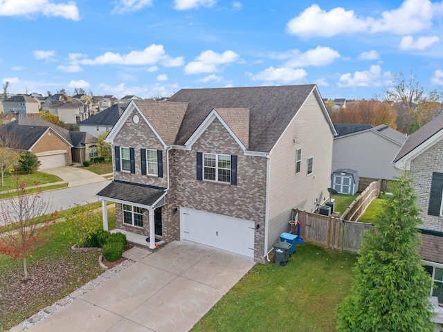 view of front of home with a garage and a front lawn