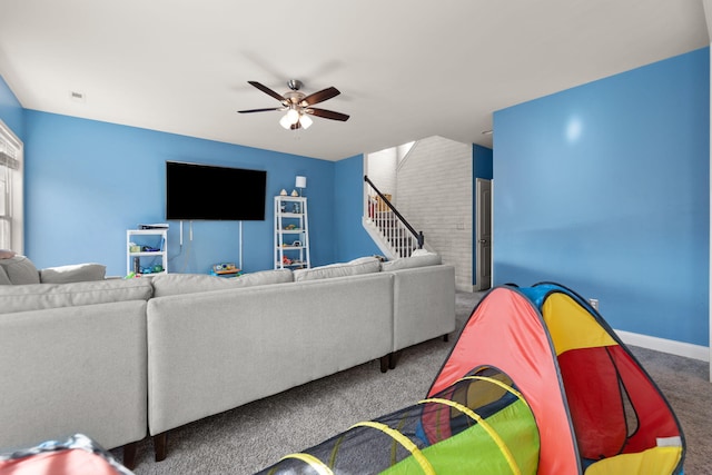 carpeted living room with ceiling fan