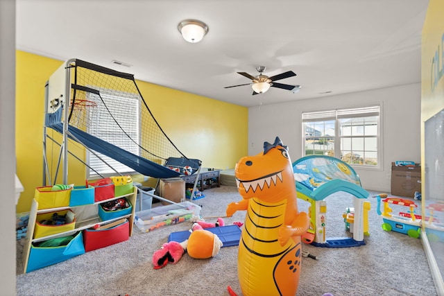 recreation room featuring ceiling fan and carpet floors