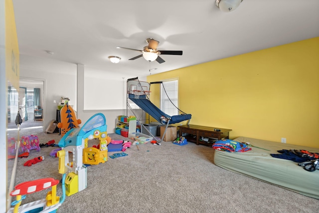 game room with ceiling fan and carpet floors