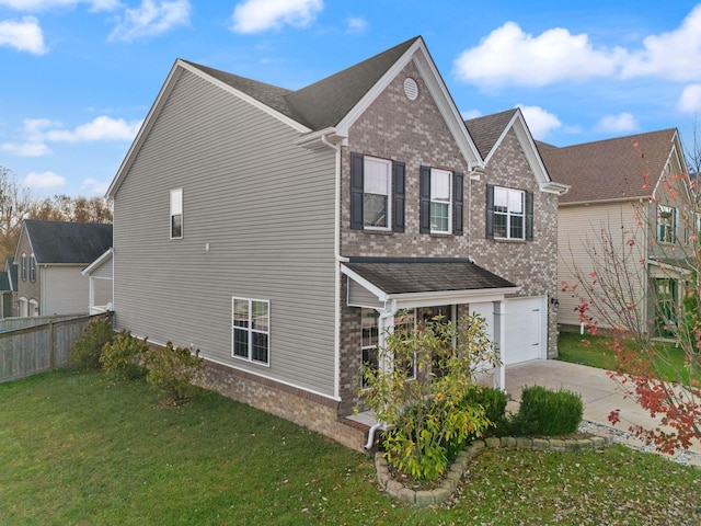 view of home's exterior with a garage and a yard