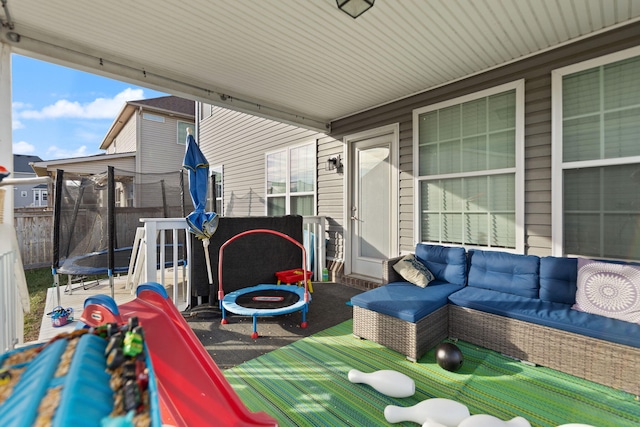 view of patio / terrace with an outdoor living space and a trampoline