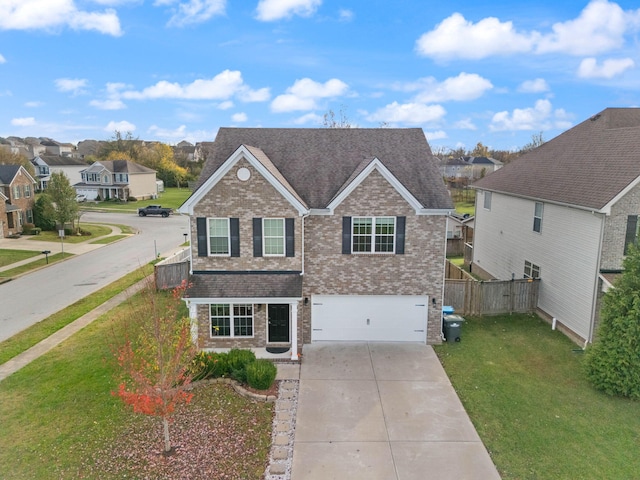 view of front of property with a garage and a front yard