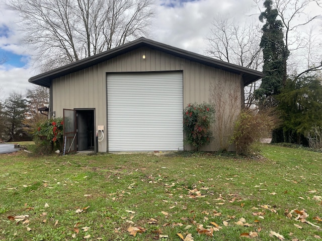 garage featuring a yard