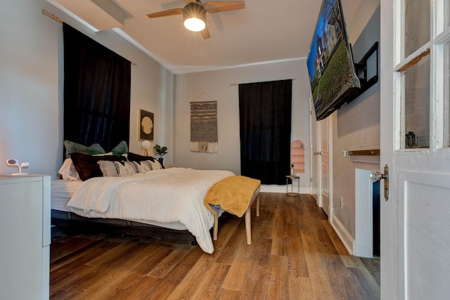 bedroom with ceiling fan and hardwood / wood-style floors