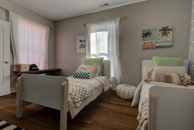 bedroom featuring dark wood-type flooring