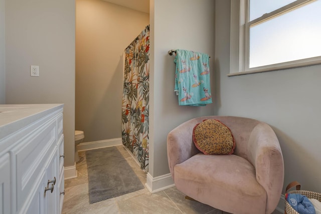 bathroom featuring tile patterned floors, vanity, toilet, and a shower with shower curtain