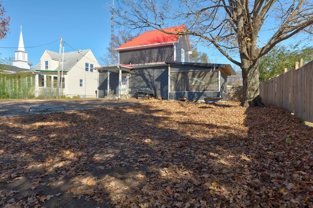 rear view of house with a sunroom