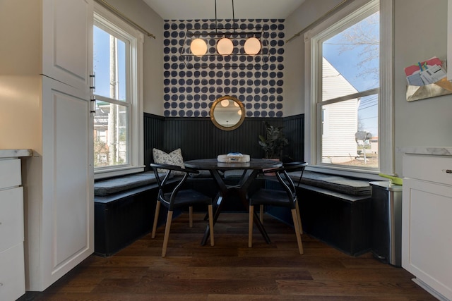 dining space featuring dark hardwood / wood-style flooring and breakfast area