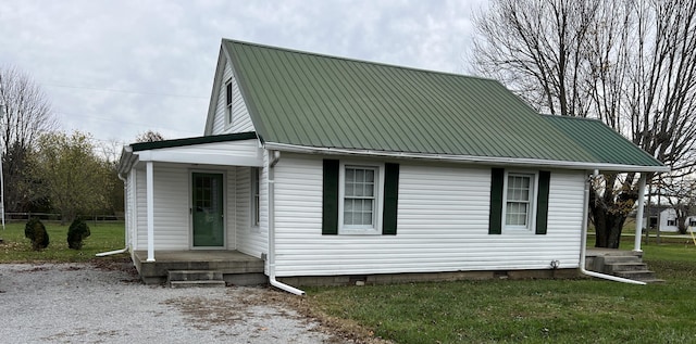 view of home's exterior featuring a lawn