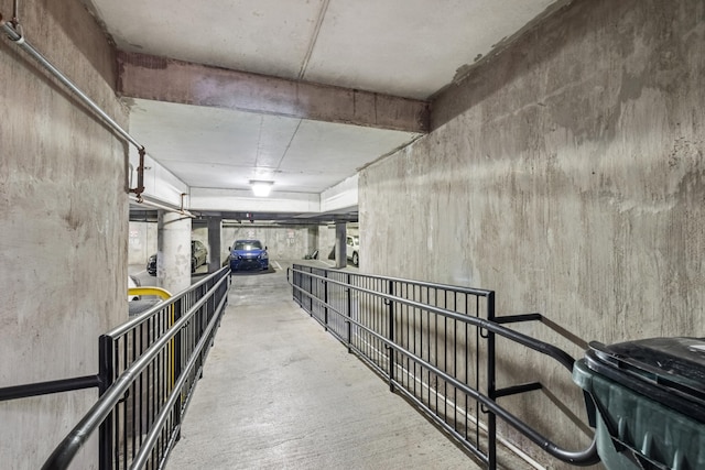 hall with concrete flooring