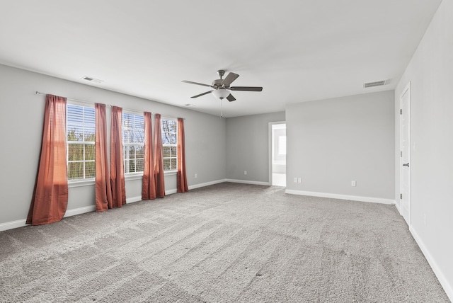 spare room with carpet flooring and ceiling fan