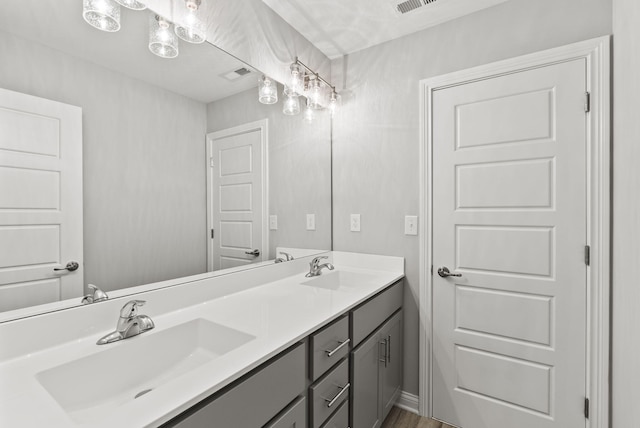 bathroom with vanity and hardwood / wood-style flooring